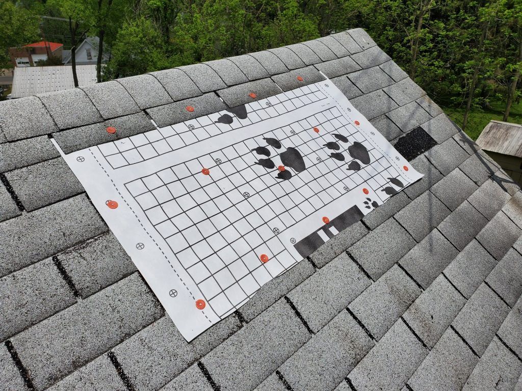A piece of paper is sitting on top of a roof.