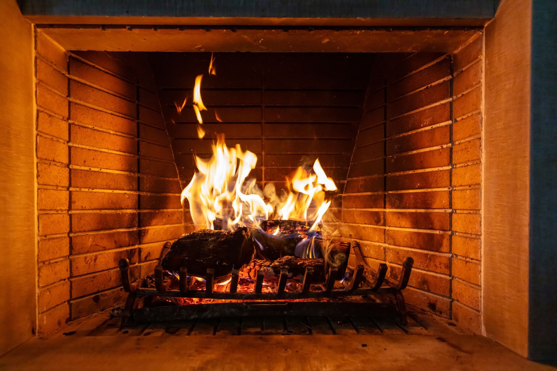 A fire going in a fireplace. 