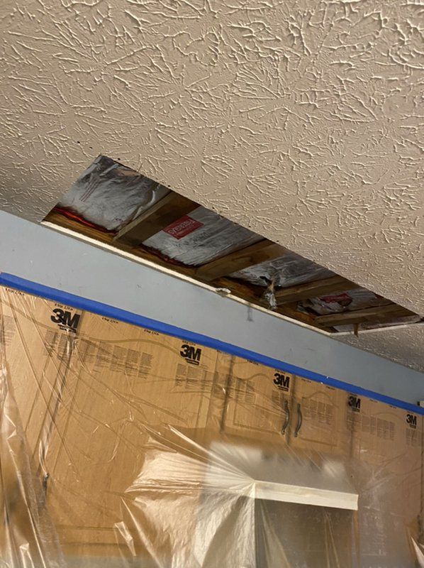The ceiling of the affected area being inspected during the restoration process.
