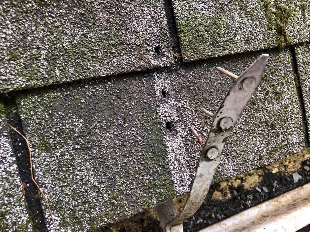A fastener that has been damaged by falling tree. 
