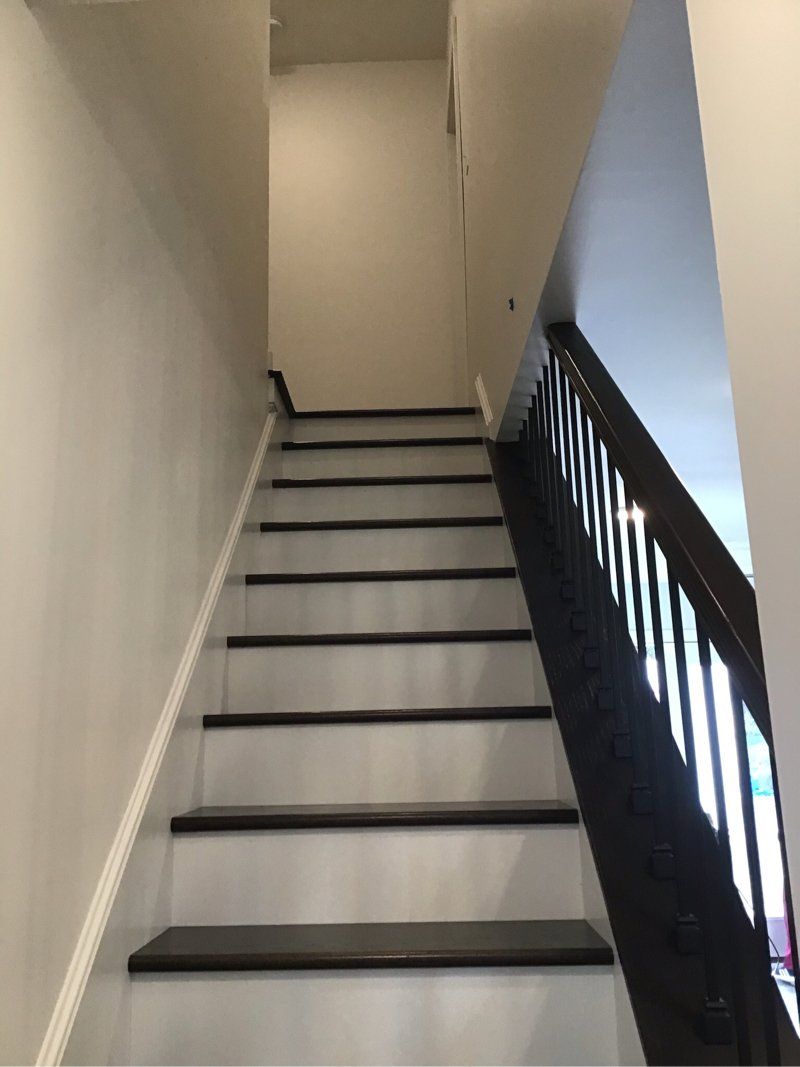 A set of stairs leading up to the second floor of a house.