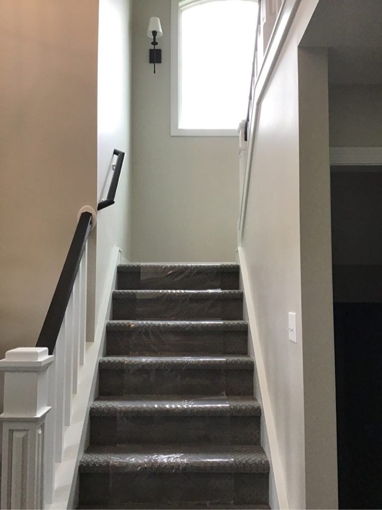 A set of stairs leading up to the second floor of a house.