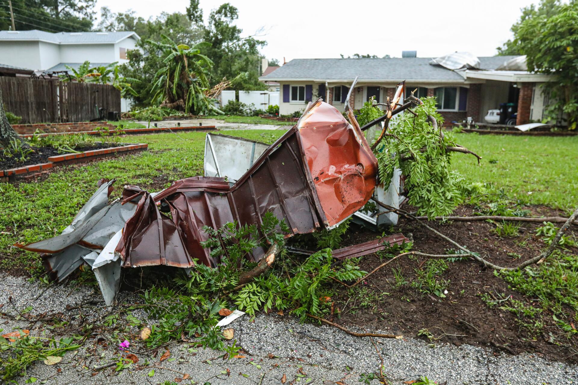 A house with a roof that has been damaged by a storm
