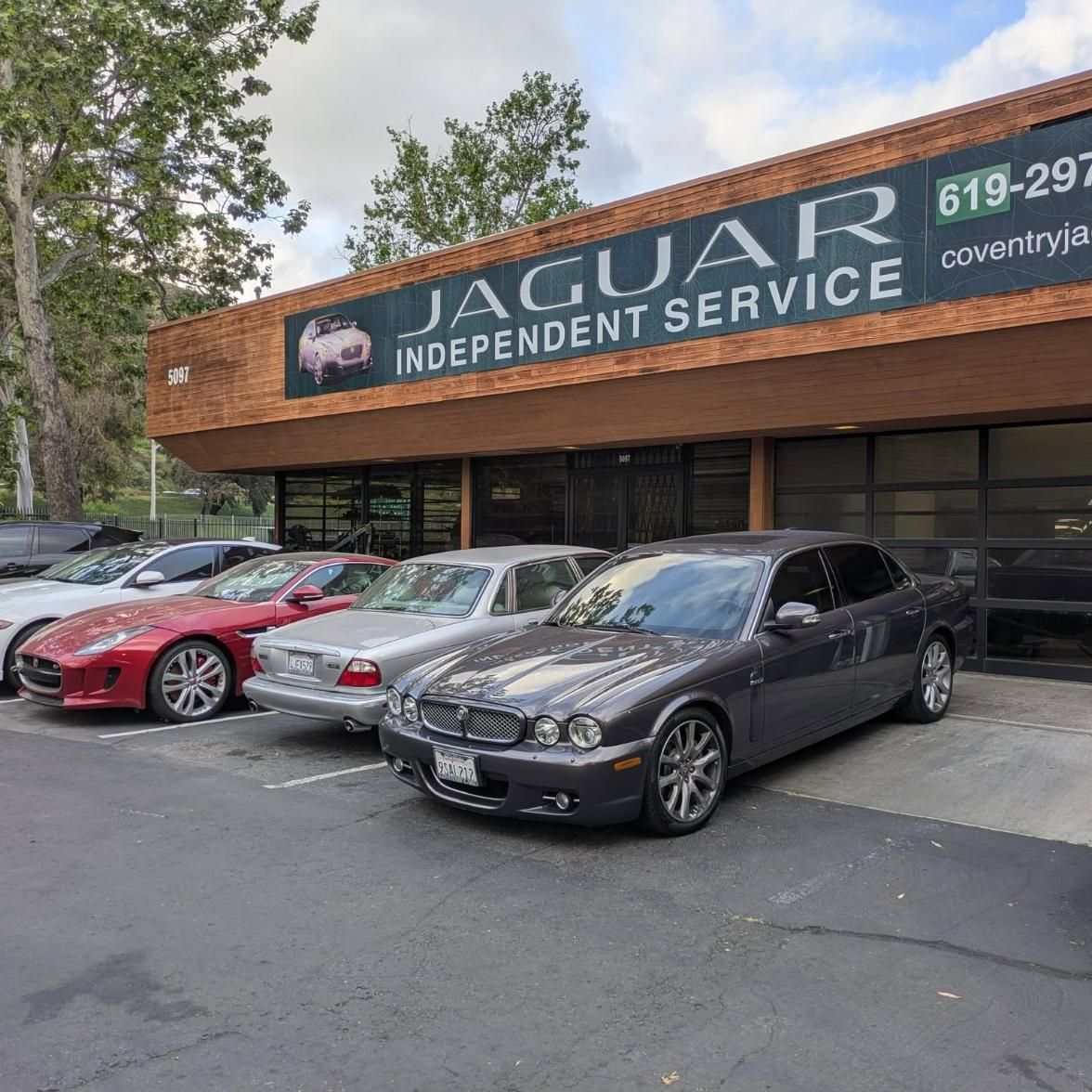 Jaguar Independent Service shop exterior with three parked cars in front