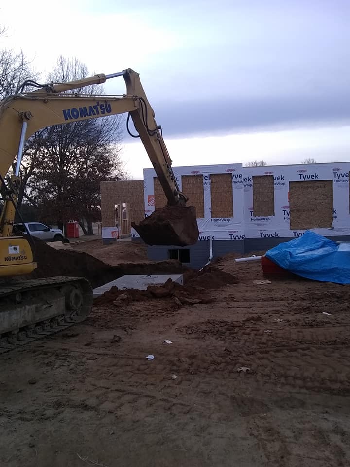 Heavy duty excavator working on ground — White Pigeon, MI — Mercers Septic & Excavating LLC Heavy duty excavator working on ground — White Pigeon, MI — Mercers Septic & Excavating LLC
