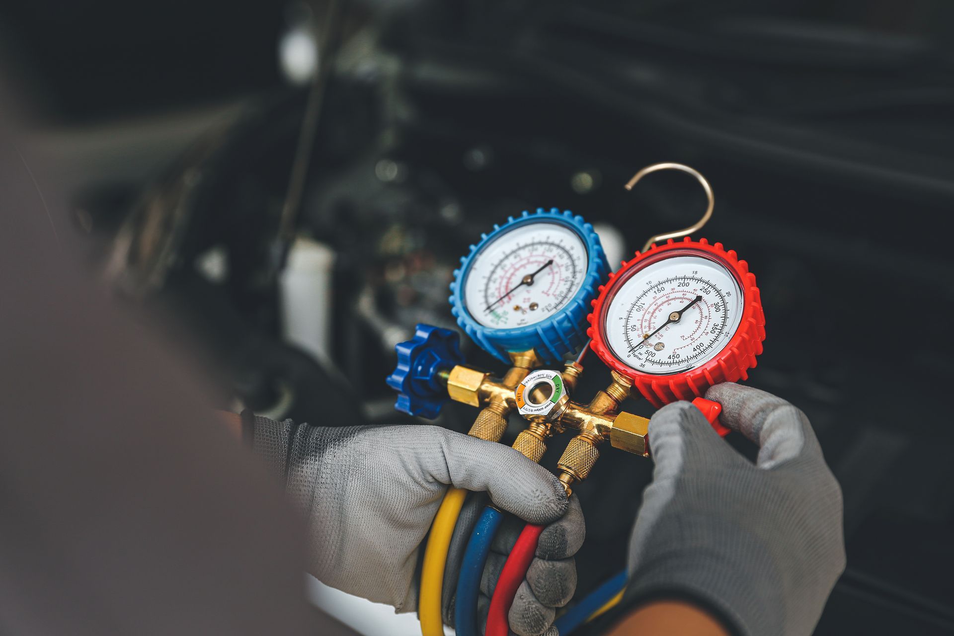 Technician working on A/C | Heights Auto Repair