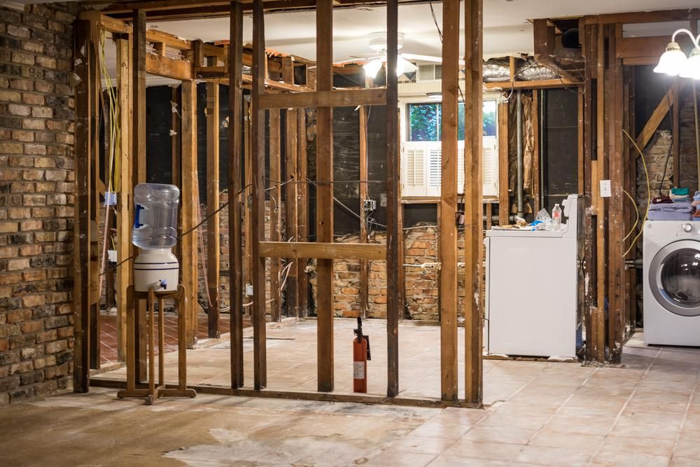 A basement under construction with a washer and dryer. — Nicho's Home Maintenance In Quirindi, NSW