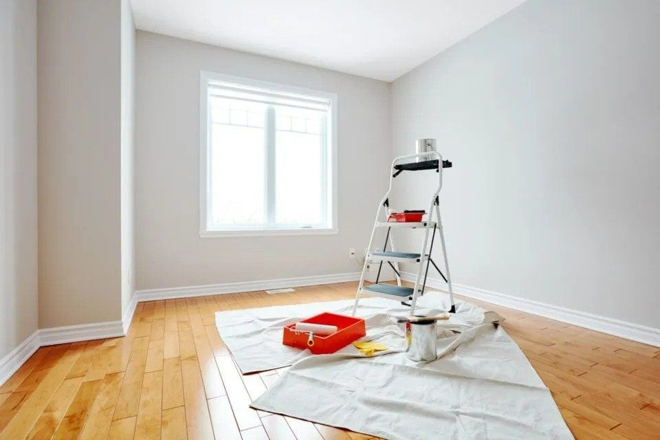 An Empty Room with A Ladder and Paint Supplies on The Floor — Nicho's Home Maintenance In Gunnedah, NSW