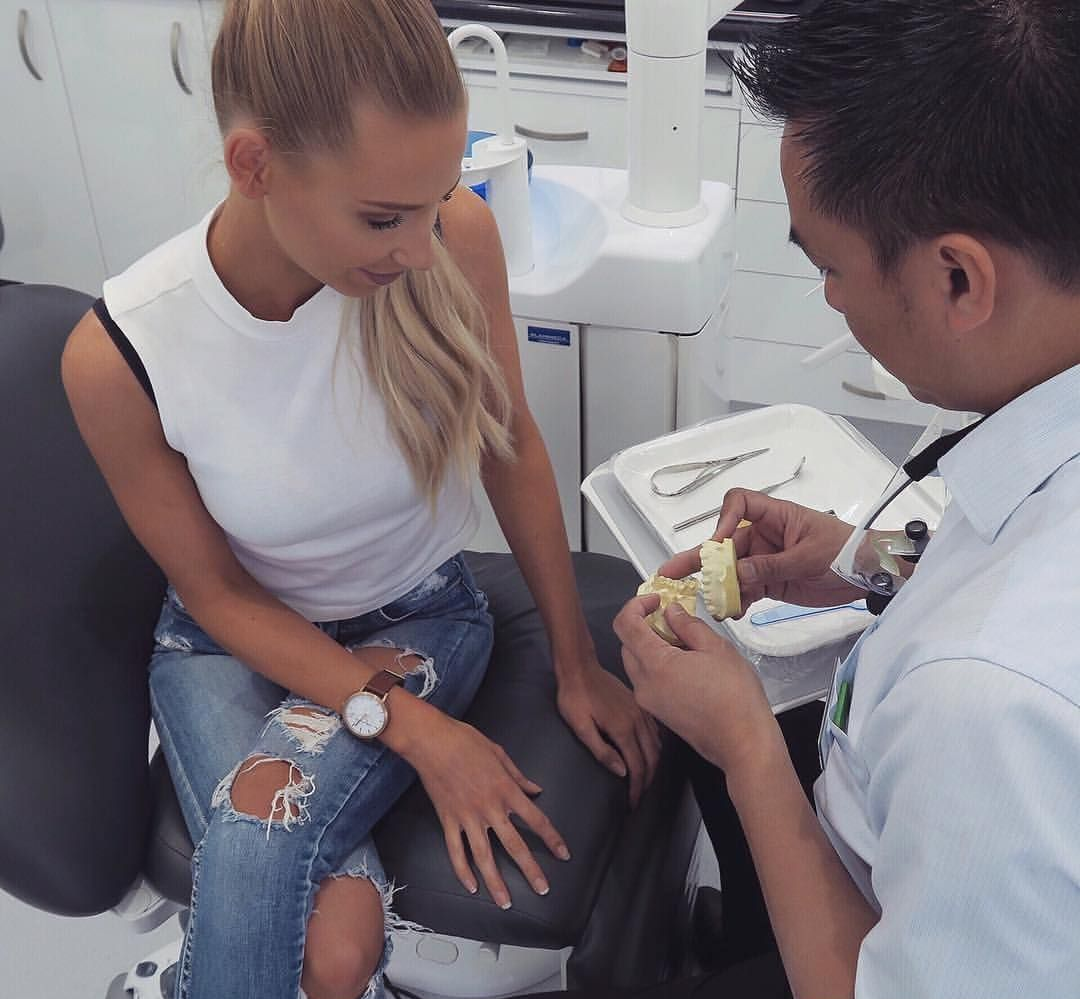 Woman in a Dental Chair, Looking at Teeth Mold — New Leaf Dentists In Erina, NSW