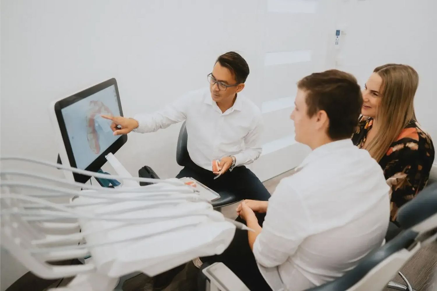 Dentist Pointing at Teeth Diagram on Monitor — New Leaf Dentists In Erina, NSW