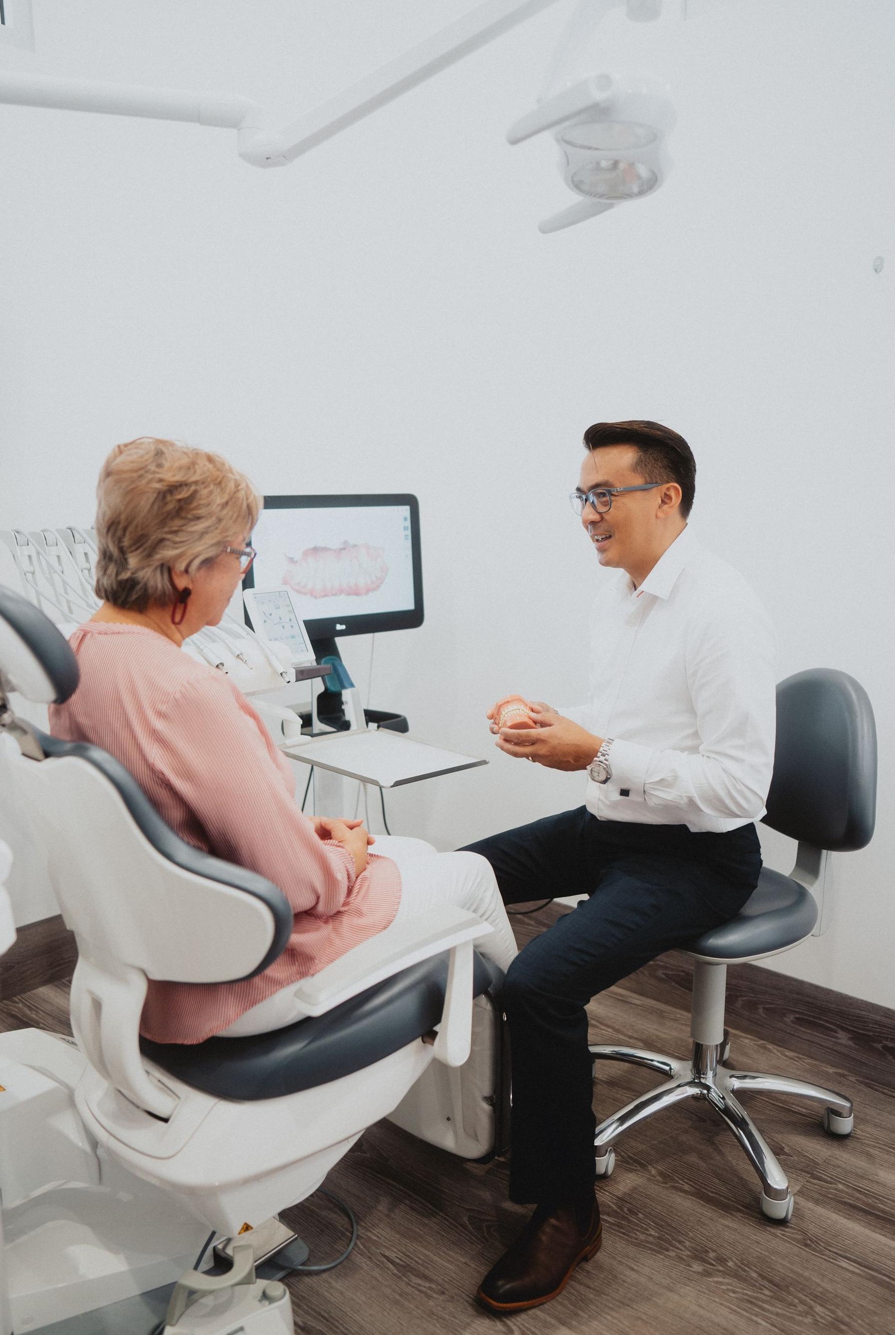 Dentist Discusses Treatment Options With Patient — New Leaf Dentists In Erina, NSW
