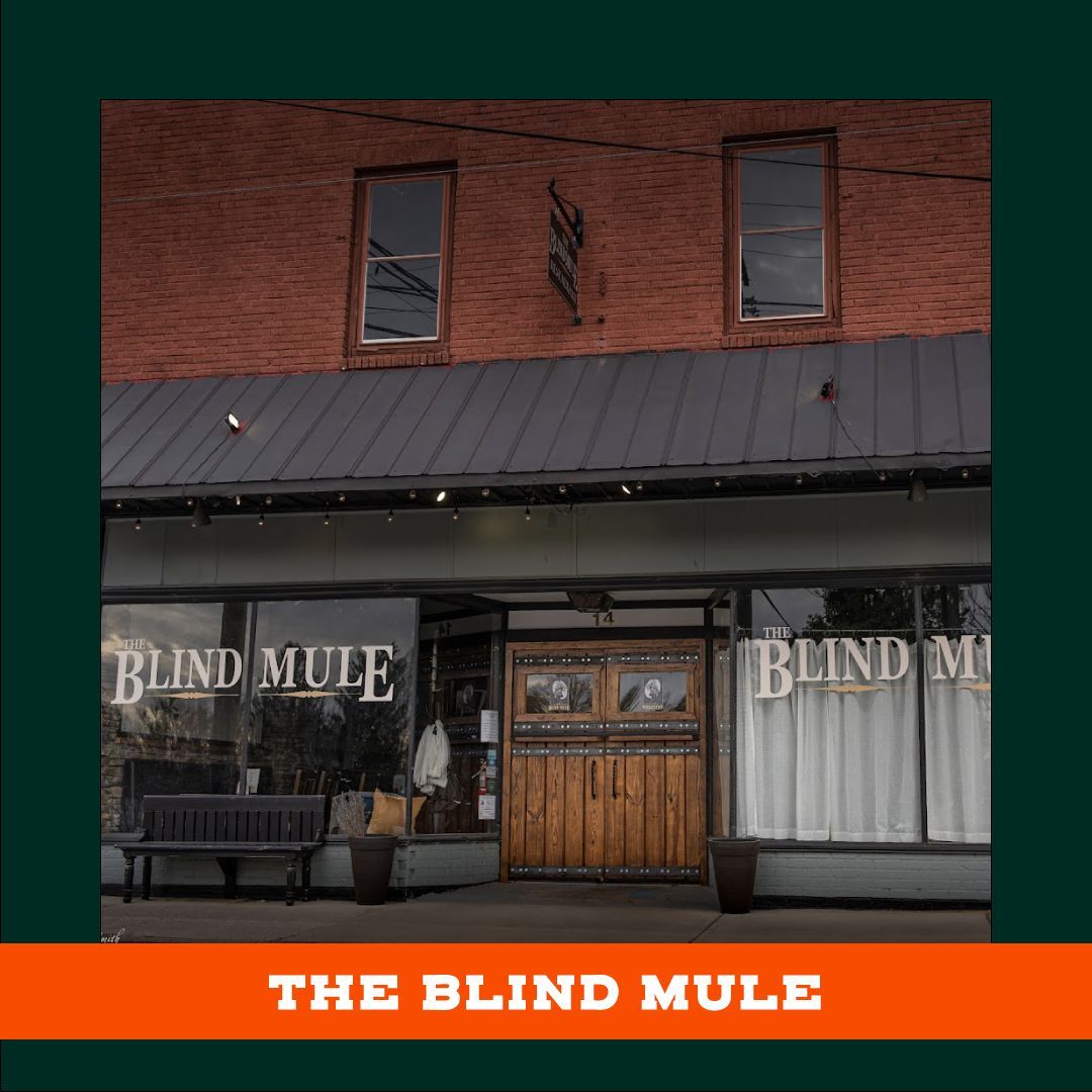 The blind mule is a restaurant located in a brick building.