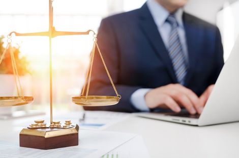 Justice Symbol Weight Scales on Table — La Quinta, CA — La Quinta Law Group Justice Symbol Weight Scales on Table — La Quinta, CA — La Quinta Law Group