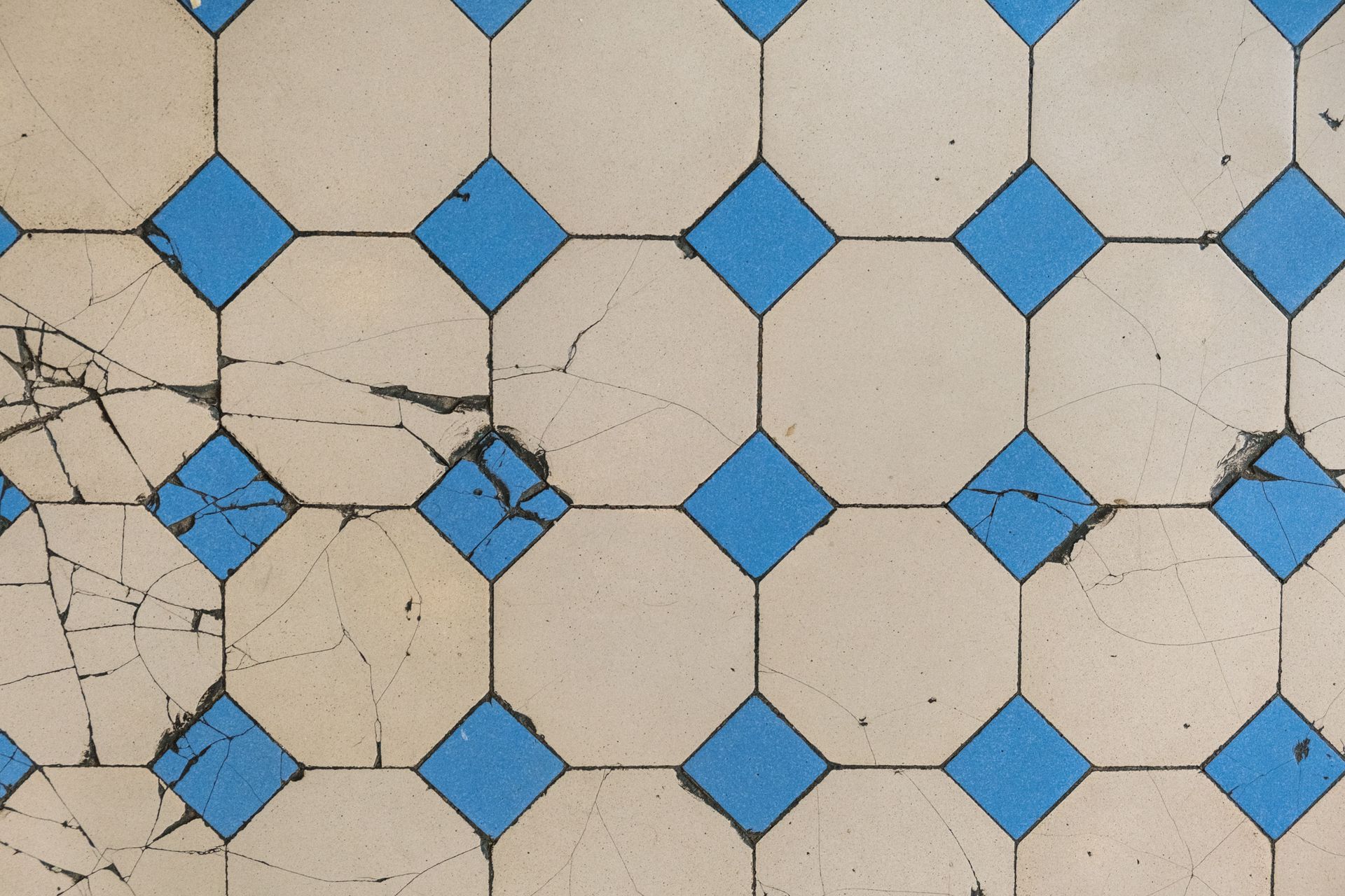 Cracked floor tiles caused by moisture under the slab
