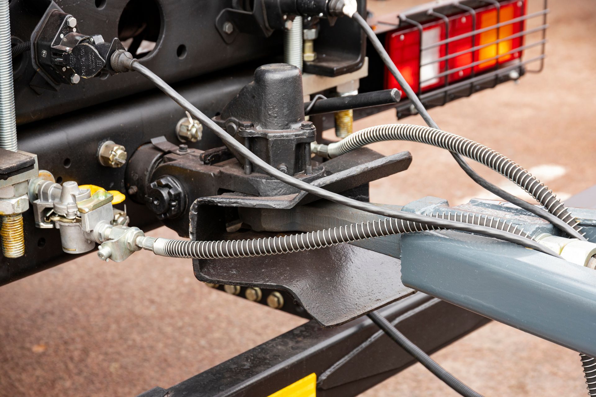Trailer hitches & wiring installation featuring tow hitch connection and electrical cables.