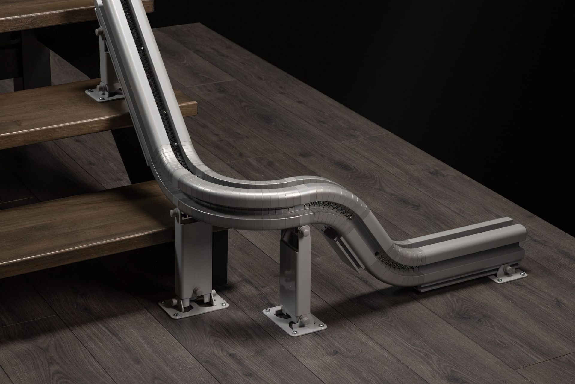 A stairlift chair unit with its disassembled track parts laid out on a clean, light surface.