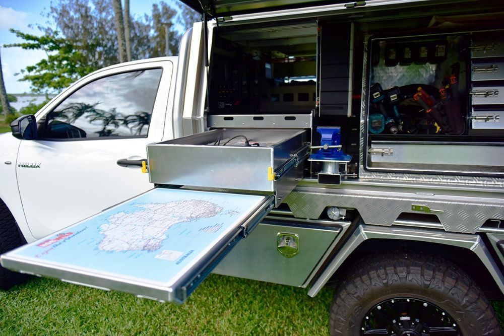 A White Truck With A Map On The Back Of It — Troy Cummings Locksmith In Bungalow, QLD