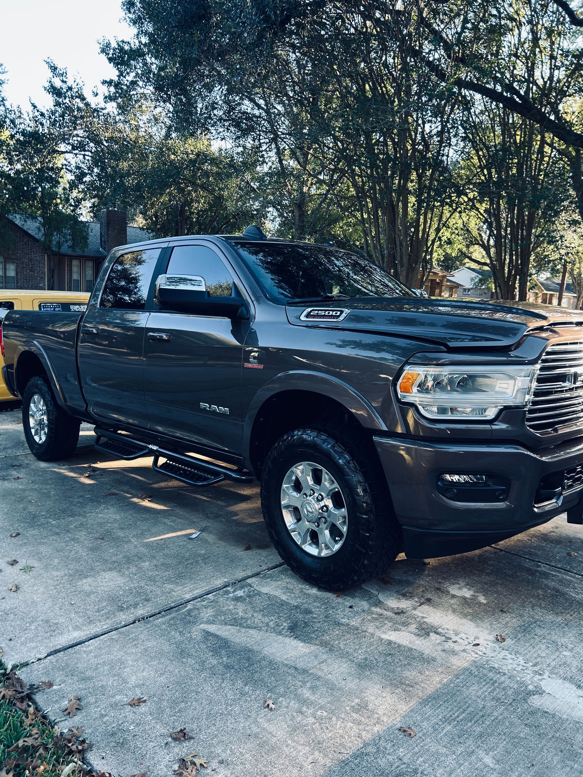 Gray Ram pickup truck parked on a concrete driveway.