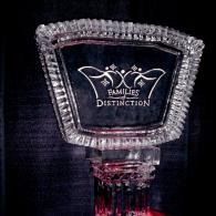 Crystal award plaque with the words “Families of Distinction” on a dark background