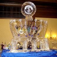 Crystal trophy on a blue tablecloth in a warmly lit room