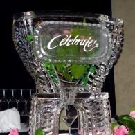Crystal display with the word “Celebrate” and green leaves inside