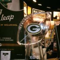 Green Bay Packers “G” logo on an ice sculptured football at an indoor display booth.