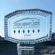 Thornberry Creek LPGA Classic crystal trophy against a stadium backdrop