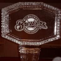 Milwaukee Brewers logo on a clear ice sculpted glass plaque against a dark background