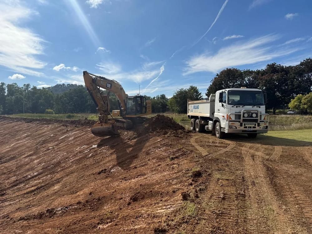 Excavator And Truck Performing Earthmoving In Dubbo