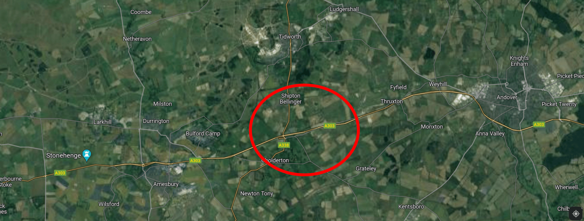 An aerial view of a rural area with a red circle in the middle.