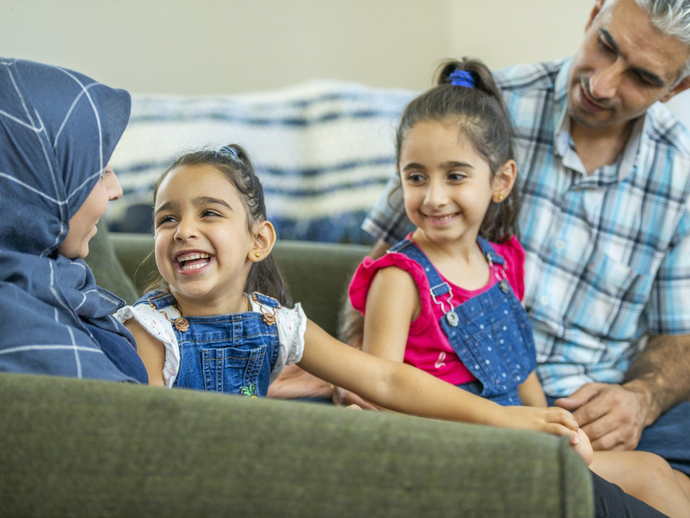 Family smiling at home