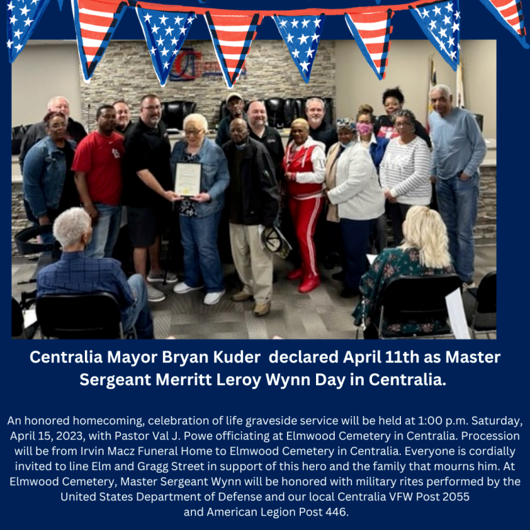 Group of people at a ceremony, Centralia Mayor declaring April 11th as Master Sergeant Wynn Day.