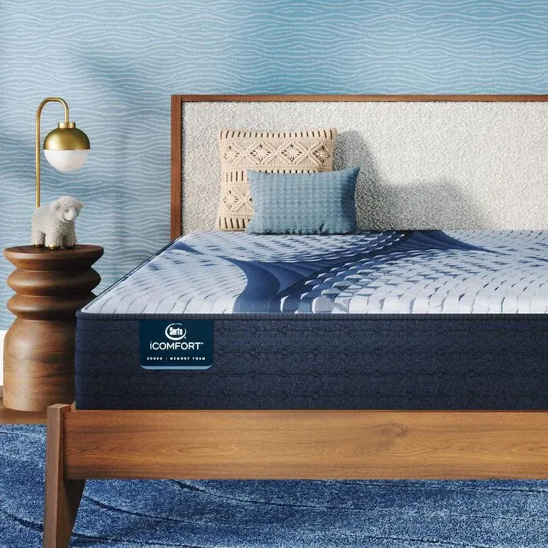 A bed with a comfort mattress on it