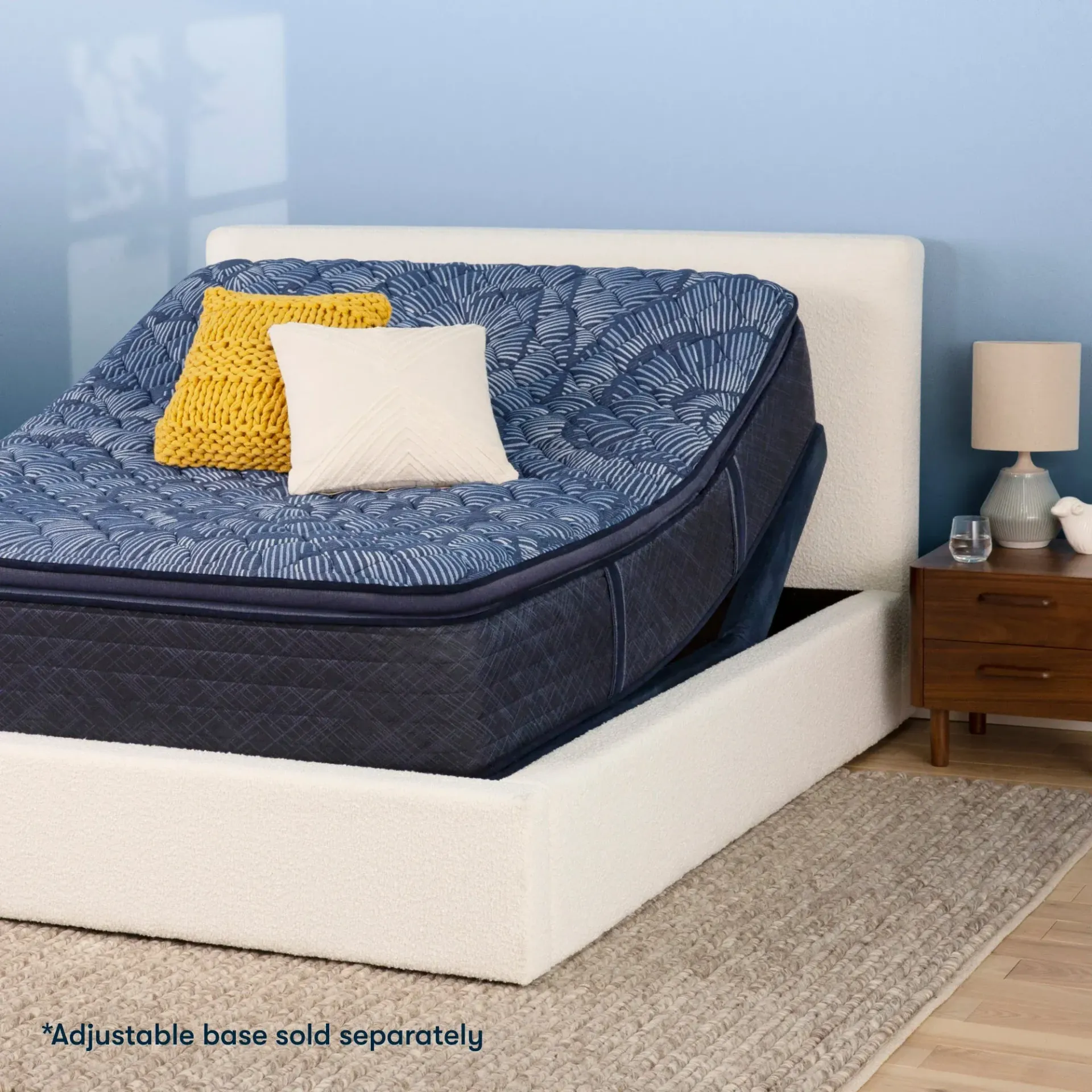 A bed with an adjustable base sold separately