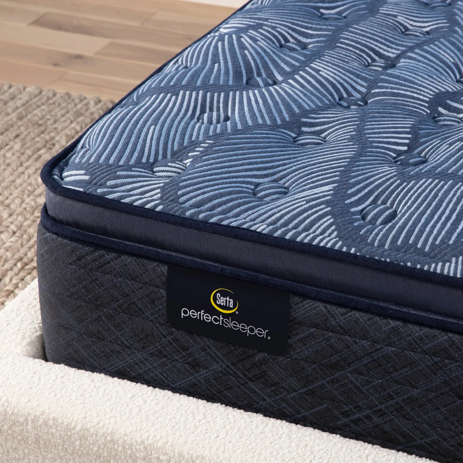 A blue mattress is sitting on top of a bed.