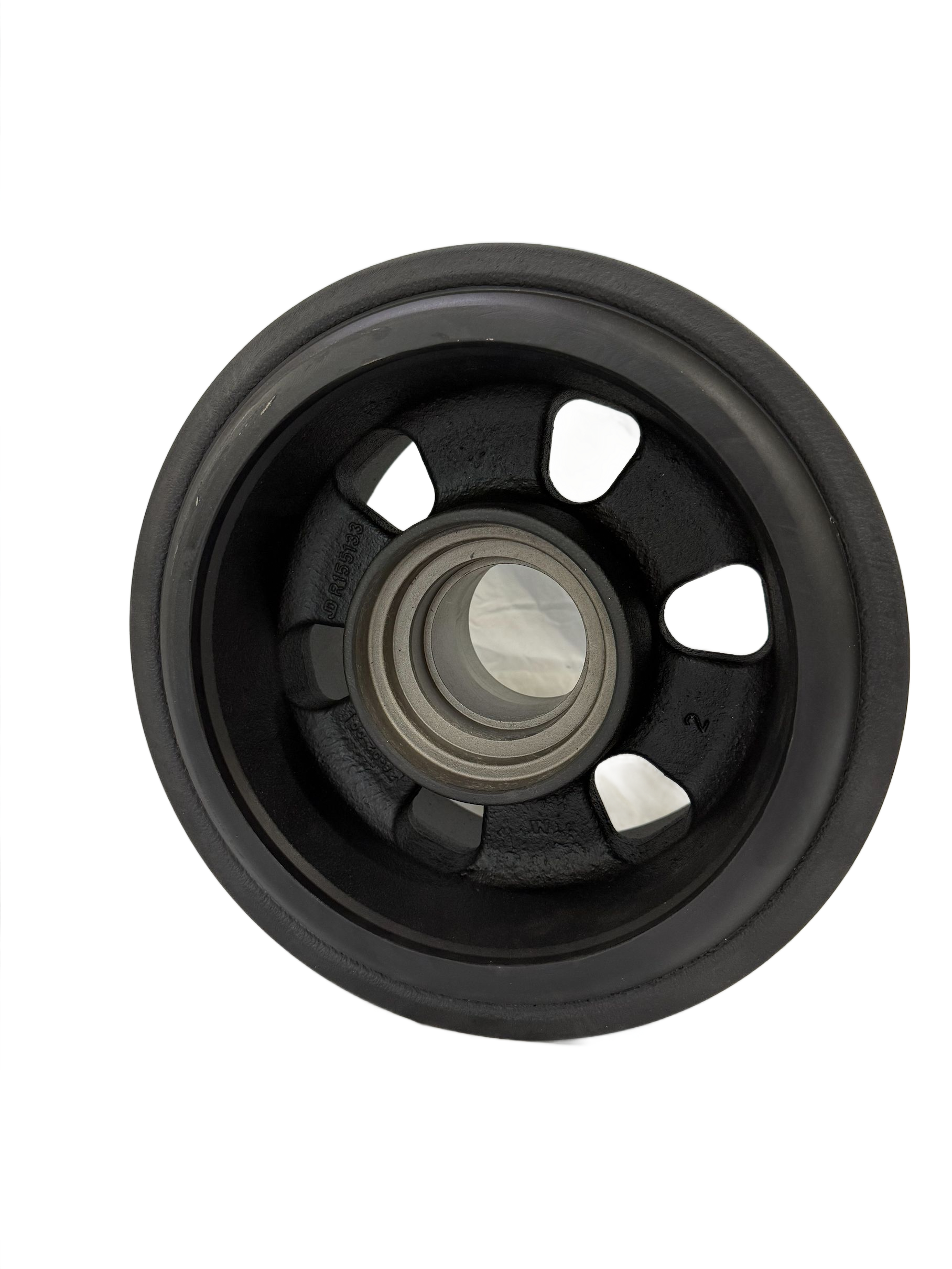 Seven worn, dusty rubber wheel rims arranged in a cluster on a white background