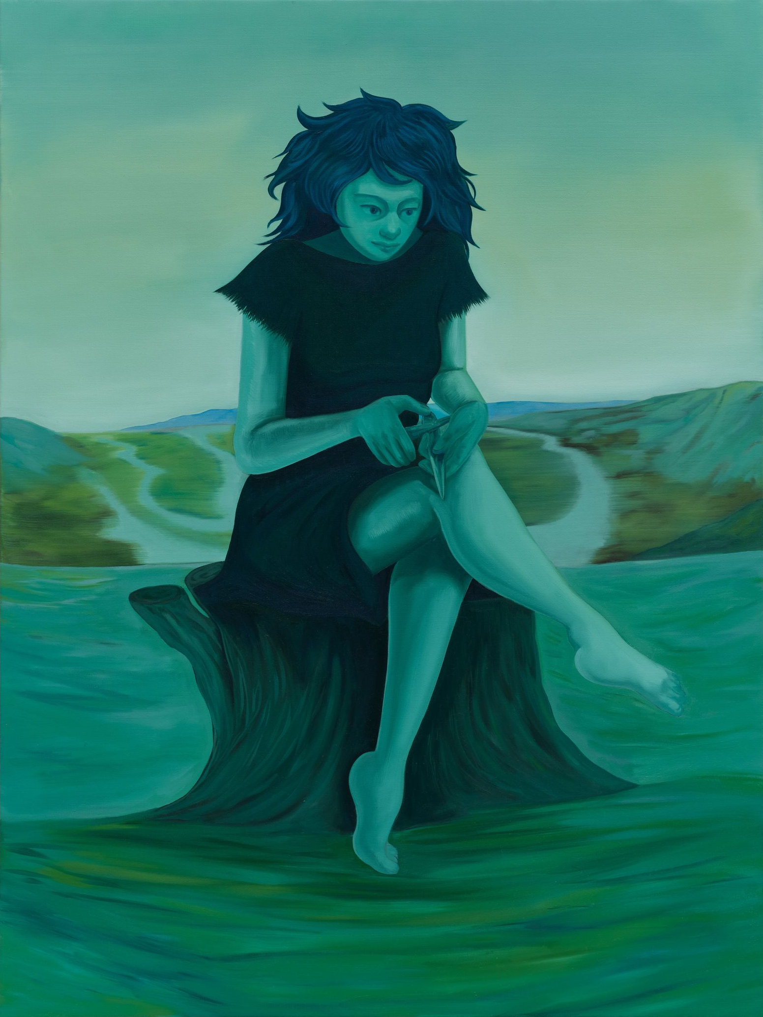Woman in black dress sitting on tree stump by water, in turquoise-green landscape.