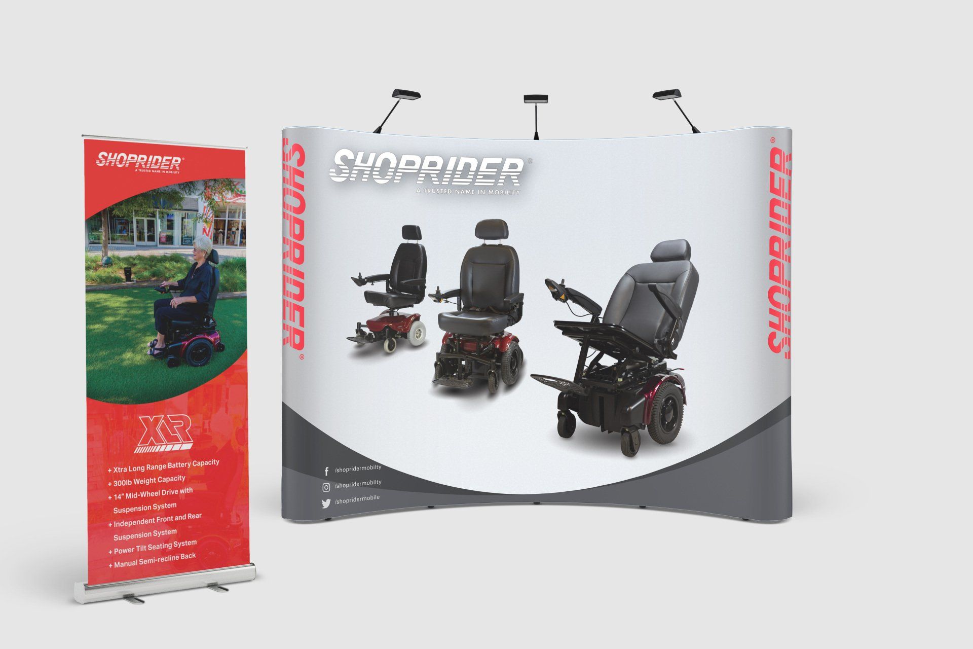 a display of electric scooters and a roll up banner .
