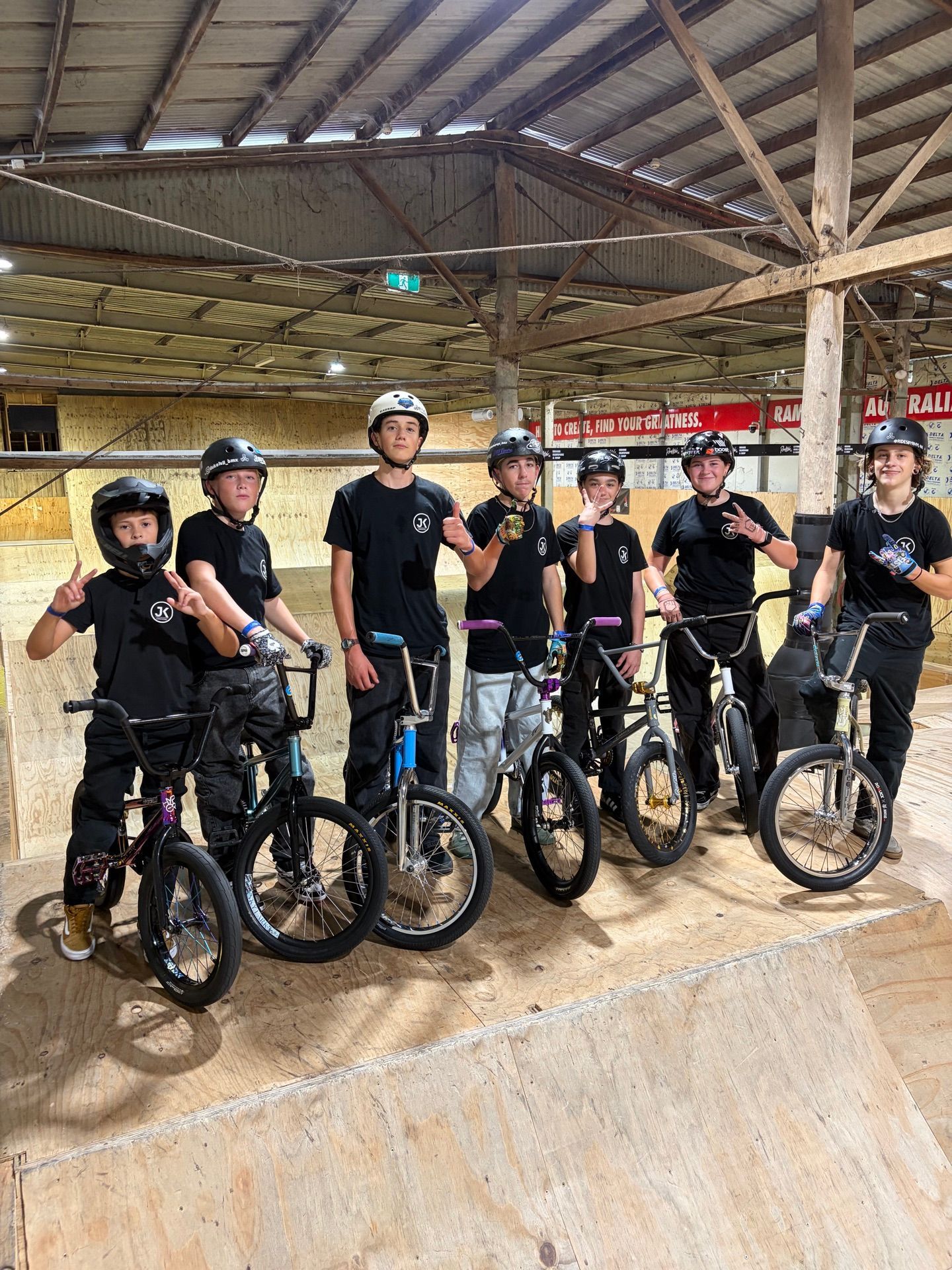 JKC riders with their bikes at an indoor training session