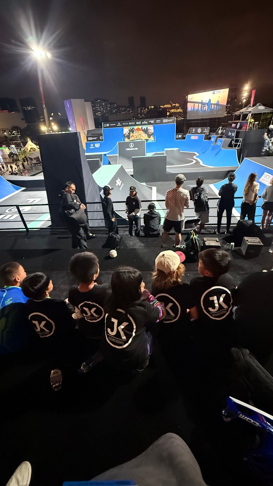 JKC riders watching the action at an international BMX event
