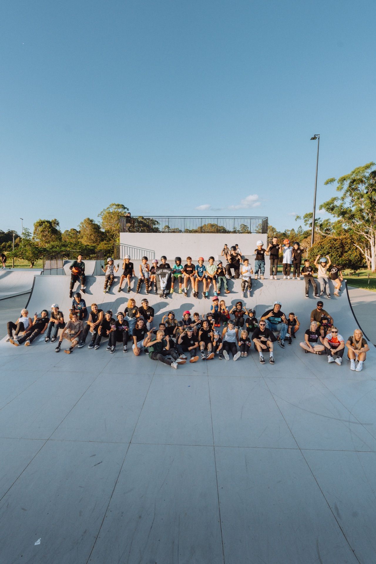 JKC community gathered on the skatepark ramp