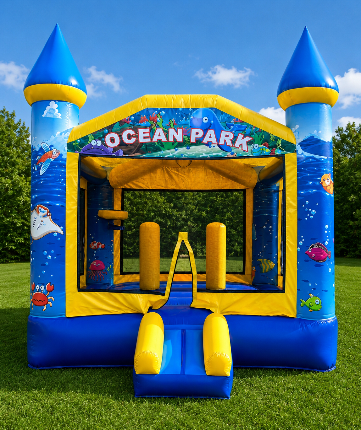 Blue and yellow Ocean Park inflatable bounce house with twin turrets on a grassy field