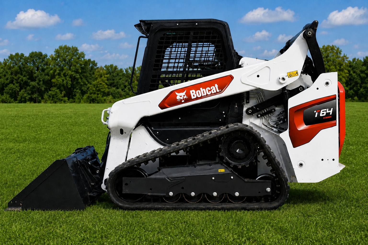 White Bobcat compact track loader on grass, side view with bucket attachment and red/orange logo in field