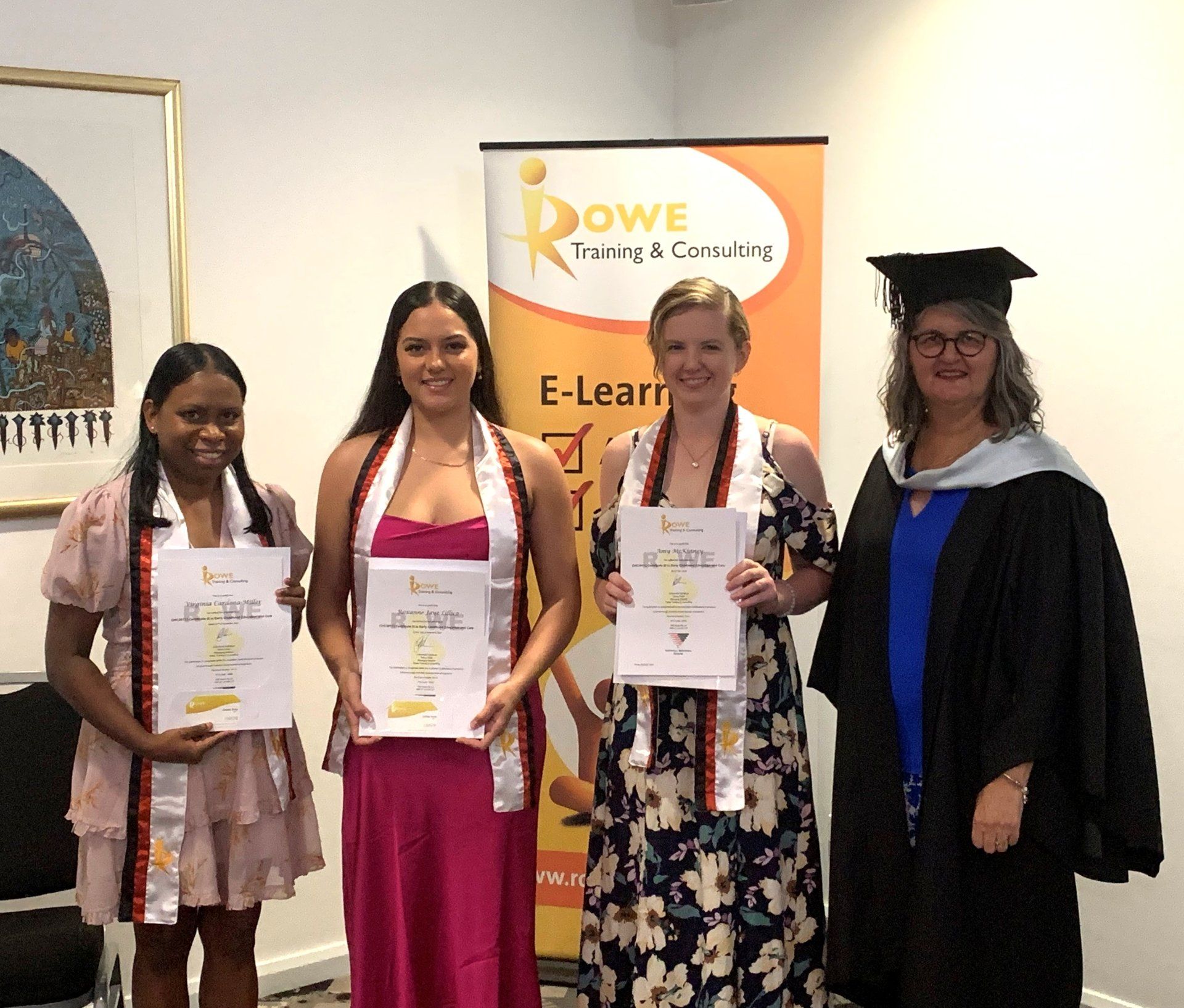 A group of women standing next to each other in front of a sign that says dowe training & consulting