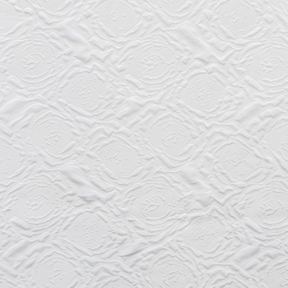 Tejido blanco texturizado con patrón en forma de rombo y círculos concéntricos en relieve.