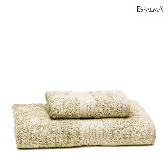 Dos toallas de baño Espalma color beige, una doblada sobre la otra.