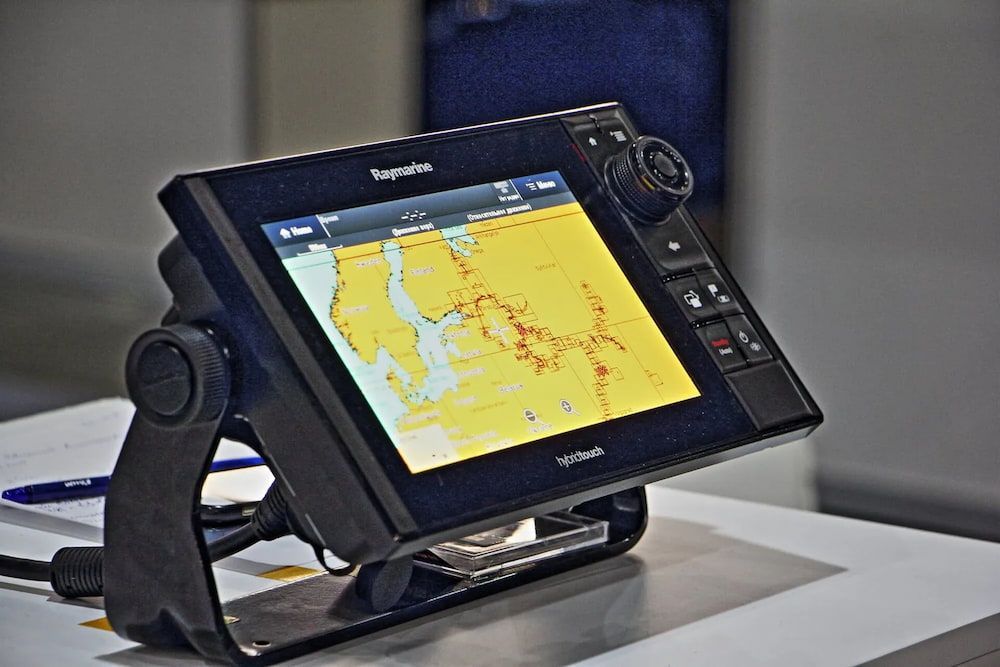 A Computer Monitor is Sitting on a Table With a Map on It — Seabourne Electronics PTY Ltd in Railway Estate, QLD