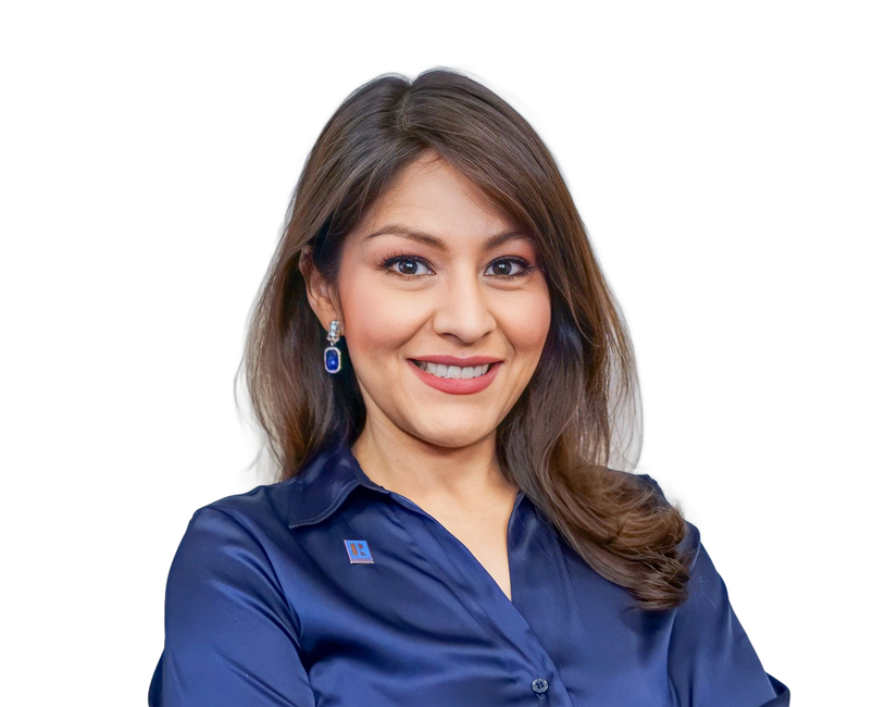 Smiling woman in a blue blouse against a white background