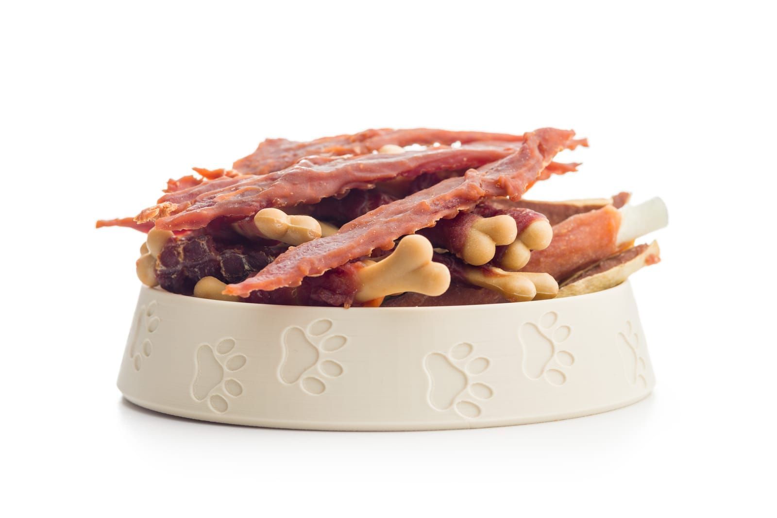 Dog food. Snack dried meat for dogs isolated on a white background.