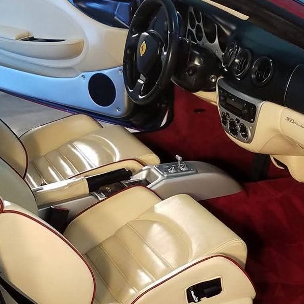 The interior of a ferrari sports car is shown